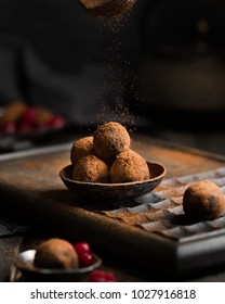 Chocolate Truffle. Dark Chocolate And Cherry Candy Sprinkled With Cocoa On A Dark Wooden Background In Rustic Style. Atmospheric Food Photo. 
Homemade Fresh Energy Balls.