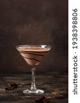 Chocolate Truffle Martini Cocktail on dark wooden background, copy space. Mudslide Truffletini cocktail recipe.