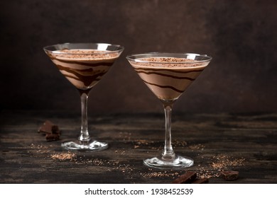 Chocolate Truffle Martini Cocktail on dark wooden background, copy space. Mudslide Truffletini cocktail recipe.