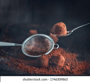 Chocolate truffles. Homemade fresh truffle dark chocolate candies with cocoa powder made by chocolatier. Gourmet food, delicious dessert. Closeup - Powered by Shutterstock