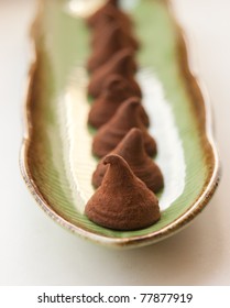 Chocolate Truffles On A Green Plate