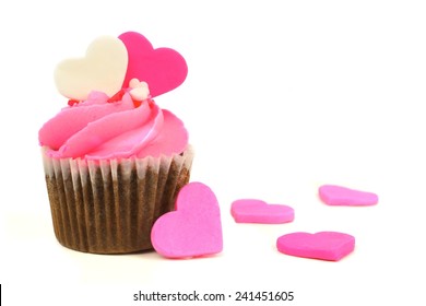 Chocolate Valentines Day Cupcake With Pink Frosting And Hearts Over White