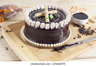 Chocolate Vanilla Cake With Wooden Background