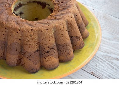 Chocolate And Vanilla Marble Cake On Wooden Background