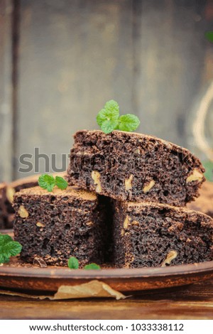 Similar – Chocolate brownie pieces on wooden background