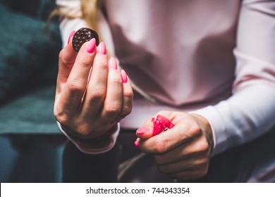 Chocolate In Woman's Hands, Opening Chocolates. A Woman Holds In Her Hand A Chocolat, A Blank, Worn Out Chocolatier, Eating Chocolate, Obesity, Unhealthy Eating, Sweet Food.