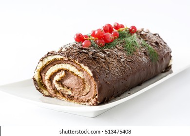 Chocolate yule log cake with red currant isolated on white background
 - Shutterstock ID 513475408