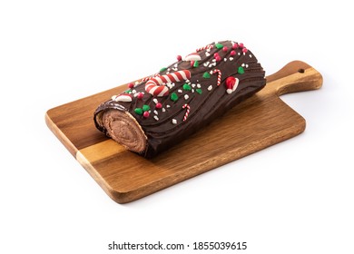 Chocolate yule log christmas cake isolated on white background