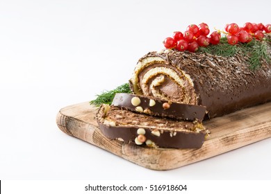Chocolate yule log christmas cake with red currant isolated.closeup
 - Shutterstock ID 516918604