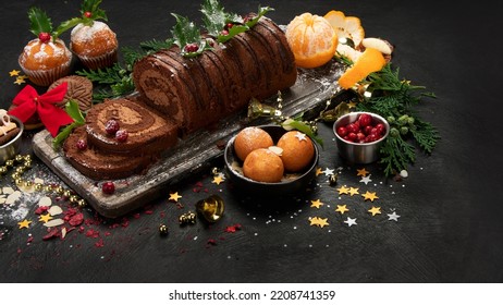 Chocolate yule log on dark background. Traditional dessert of Christmas time. - Shutterstock ID 2208741359