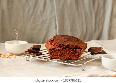 Chocolate-banana Loaf Cake On Wire Rack On A Light Linen Cloth.Holiday Baked Goods Concept. Copy Space.