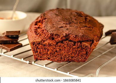 Chocolate-banana Loaf Cake On Wire Rack On A Light Linen Cloth.Holiday Baked Goods Concept.