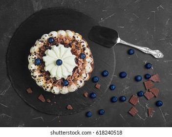 Chocolate-berry Savoyardi Ice-cream Cake Torte. Ingredients For Blueberry Ice Cream Cake Savoyardi Torte And Chocolate Pieces. Dark Black Background. Top View From Above And Copy Space.