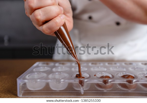 Chocolatier Pours Chocolate Into Molds Chef Stock Photo 1385255330 ...