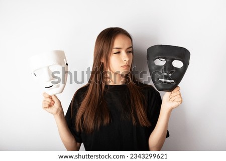 choice between good and evil, good and bad, young teen girl with black and white mask