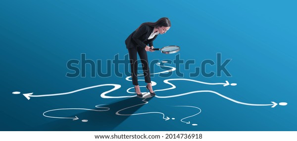 Choice and find your way concept with\
businesswoman looking through a magnifying glass on arrow roads\
drawn on bright blue\
surface