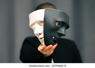 choice of personal growth and self-development, between good and bad, poor and rich, good and evil, woman with black and white masks - Shutterstock ID 2079468175