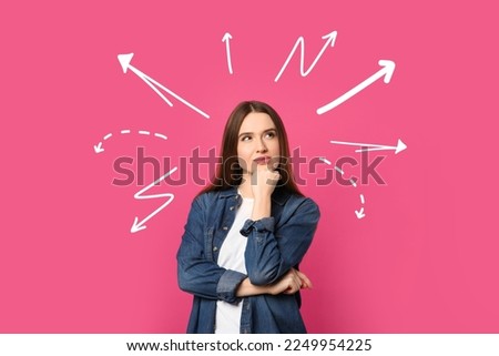 Choice in profession or other areas of life, concept. Making decision, thoughtful young woman surrounded by drawn arrows on pink background