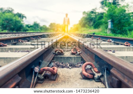Choice with spliting in two ways pathway to success concept a man think the railroad  go to the light at the destination  with space area for write some text on background meaning walk to success