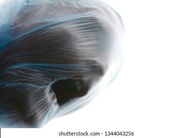 Choke. A man with blue transparent plastic bag over his head is suffocating. Suffocation. Copy space for text.