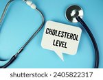 Cholesterol Level text message on speech bubble with Stethoscope  top view on blue background, Health concept background
