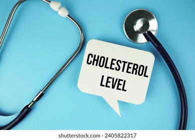 Cholesterol Level text message on speech bubble with Stethoscope  top view on blue background, Health concept background