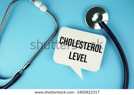 Cholesterol Level text message on speech bubble with Stethoscope  top view on blue background, Health concept background