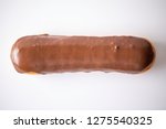 Cholocolate bar, eclair, or long john donut on a white background