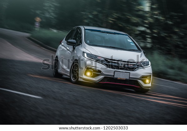 CHONBURI -\
September 16: White Car Honda Jazz GK race car driver on the road.\
Stock photography Space for text. Background with car. September\
16, 2018 in Chonburi,\
Thailand