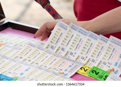 Chonburi, Thailand - 31 MAR 2019 : Woman Hand Is Selecting The Thai Lotto/Thai Lotterry