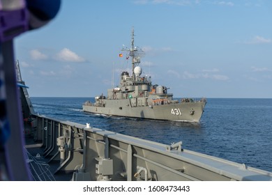 CHONBURI, THAILAND - DECEMBER 24, 2019 : H.T.M.S. TAPI, The Coastal Defence Frigate Of Thai Navy Sails Along The Other Ship Between Annaul Exercise In Gulf Of Thailand.