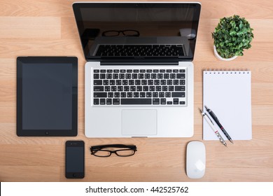 CHONBURI, THAILAND - JUNE 19, 2016: Apple IPhone, IPad, Macbook Pro And Note Book On Wooden Desk. Apple Inc.