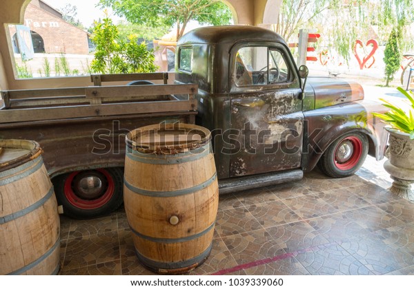 Chonburi, Thailand - May 19, 2017: Old truck and\
two bucket at Swiss Sheep\
Farm.
