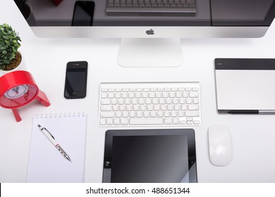 CHONBURI, THAILAND - SEPTEMBER 25, 2016: Top View IMac Monitor Computers, Keyboard, IPhone, IPad And Magic Mouse On White Desk, Created By Apple Inc.