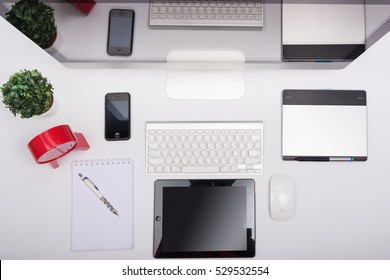 CHONBURI, THAILAND - SEPTEMBER 25, 2016: Top View IMac Monitor Computers, Keyboard, IPhone, IPad And Magic Mouse On White Desk, Created By Apple Inc.