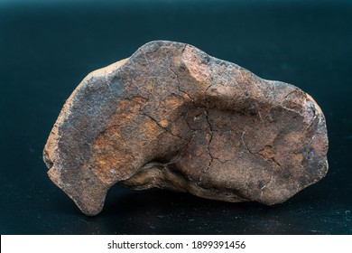 Chondrite Meteorite Isolated, Piece Of Rock Formed As An Asteroid In The Universe At During Solar System Creation. The Meteorite Comes From An Asteroid Fall Impacting Earth At Atacama Desert