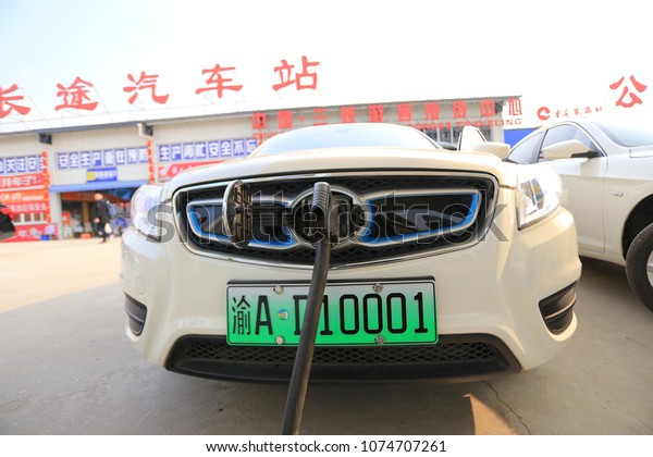 Chongqing, China—April 19, 2018: New\
energy vehicles, electric new energy vehicles that are charging at\
charging stations using charging posts, front\
view