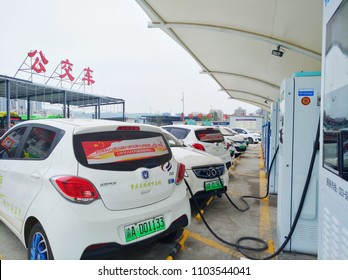 Chongqing, China – May 28, 2018: New Energy Electric Vehicle, New Energy Vehicle Charging At Charging Station Using Charging Pole