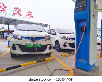 Chongqing, China – May 28, 2018: New Energy Electric Vehicle, New Energy Vehicle Charging At Charging Station Using Charging Pole