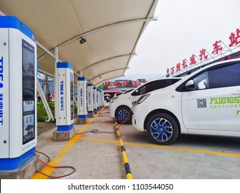 Chongqing, China – May 28, 2018: New Energy Electric Vehicle, New Energy Vehicle Charging At Charging Station Using Charging Pole