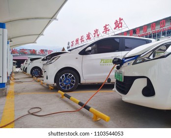 Chongqing, China – May 28, 2018: New Energy Electric Vehicle, New Energy Vehicle Charging At Charging Station Using Charging Pole