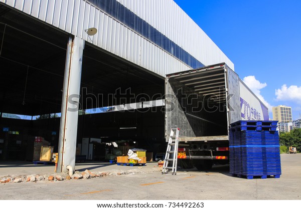 Chongqing, China -- September 14, 2017: A lorry\
is parked at the gate of the warehouse, and the logistics company\
is called zhongtong\
express