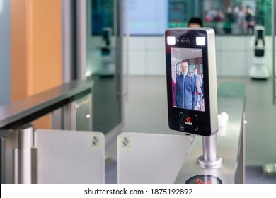 Chongqing, China-October 3, 2020:  Chinese Man Using Face Identification Before Entering The Turnstile Gate.