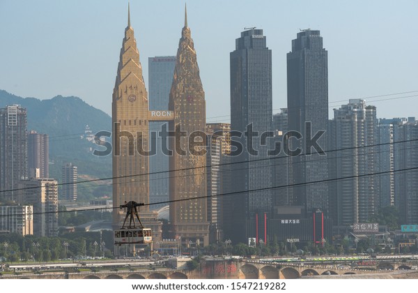 Chonqging, China - November 01, 2019: The\
cable car in Chongqing in China is used by both locals and\
tourists. The cable car crosses over the Jialing\
River.