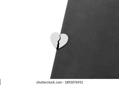 Choose Between Good And Evil. Being Good Or Bad Concept. Broken Wounded Heart On Border Of Good And Evil. Flat Lay. Top View. Monochrome