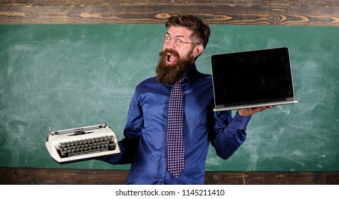 Choose Right Teaching Method. Modern Instead Outdated. Teacher Bearded Hipster Holds Typewriter And Laptop. Teacher Choosing Teaching Approach. Digital Against Retro. Modern Technologies Benefit.