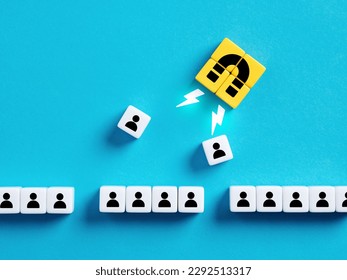 Choosing the best candidate for hiring. Recruitment, staffing and human resources management. Employee selection. Attracting new customers or followers. Magnet pulls employees out of row of cubes.