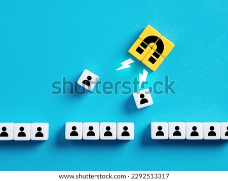 Choosing the best candidate for hiring. Recruitment, staffing and human resources management. Employee selection. Attracting new customers or followers. Magnet pulls employees out of row of cubes.