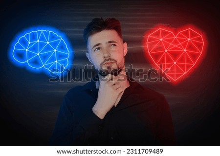 Choosing between logic and emotions. Thoughtful man between glowing illustrations of heart and brain on black background