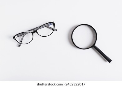 Choosing between vision glasses and a magnifying glass, top view